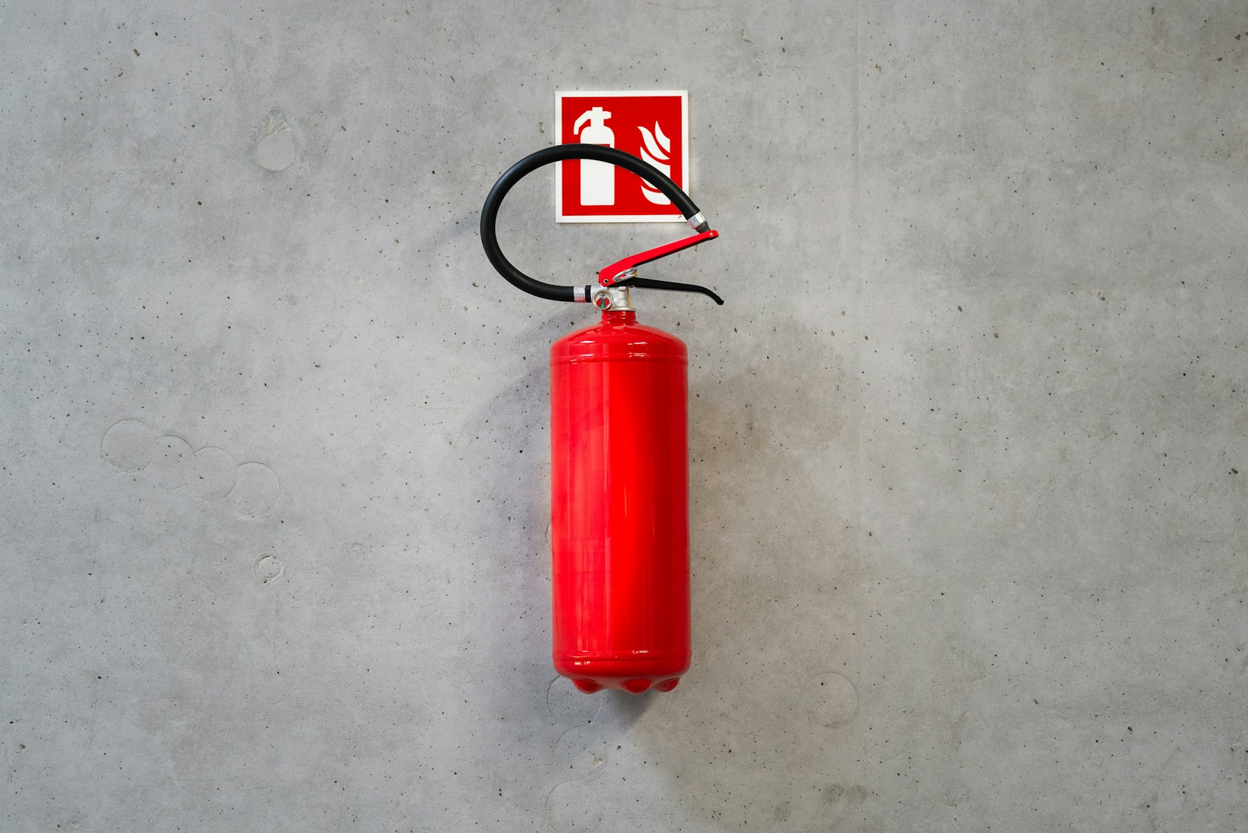 Wall-mounted fire extinguisher
